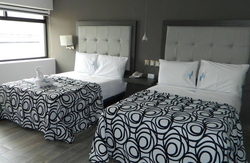 Centro Hotel | Three Comfortable and Airy Rooms with Easy Access to Beach & Local Fun