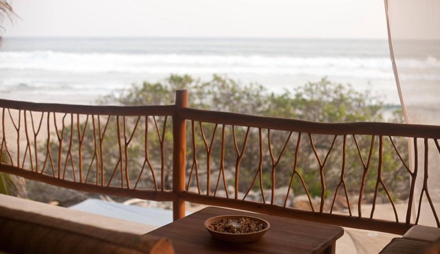 Secluded beachfront 1BR+ with panoramic ocean views & sandy swimming beach